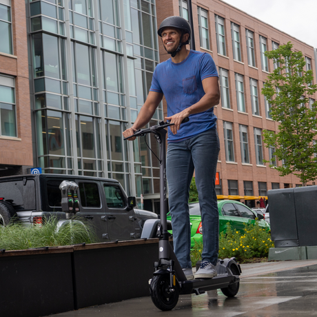 Model riding the G6 electric scooter