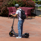 Model riding the G6 electric scooter